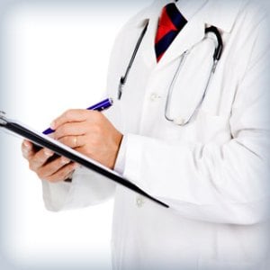 Photo: Privacy Policy - doctor in a while coat with pen and clipboard